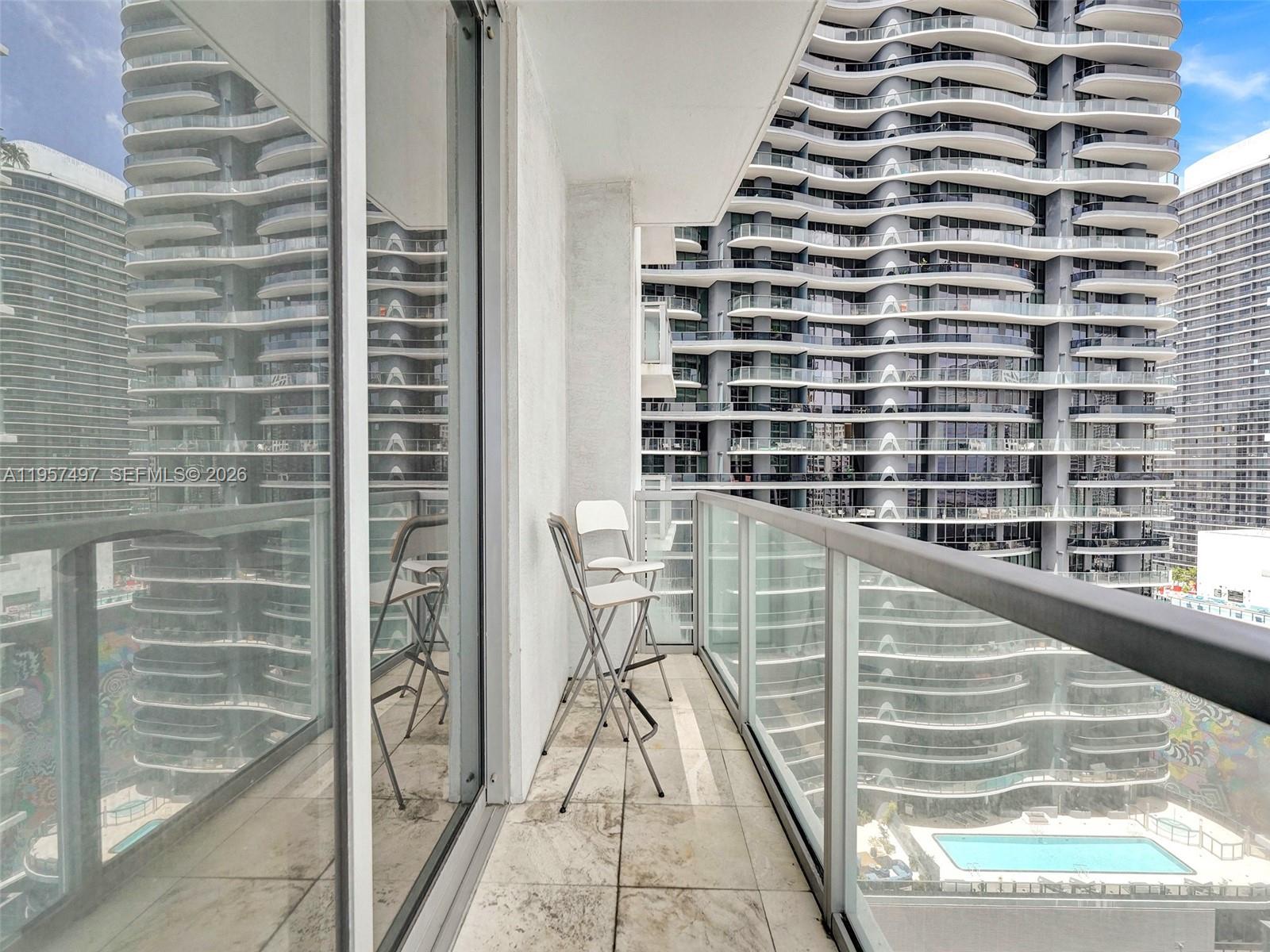 1050 Brickell Avenue, Unit 2722 Miami, FL 33131 - Photo 17 of 19 a view of balcony with wooden floor
