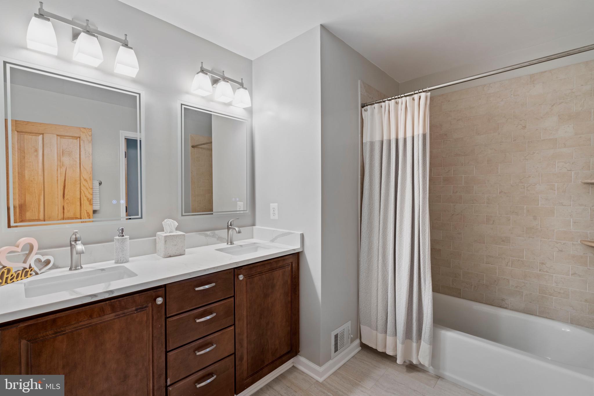18012 Highfield Road Ashton, MD 20861 - Photo 19 of 39 Hall bathroom with double vanity/private toilet