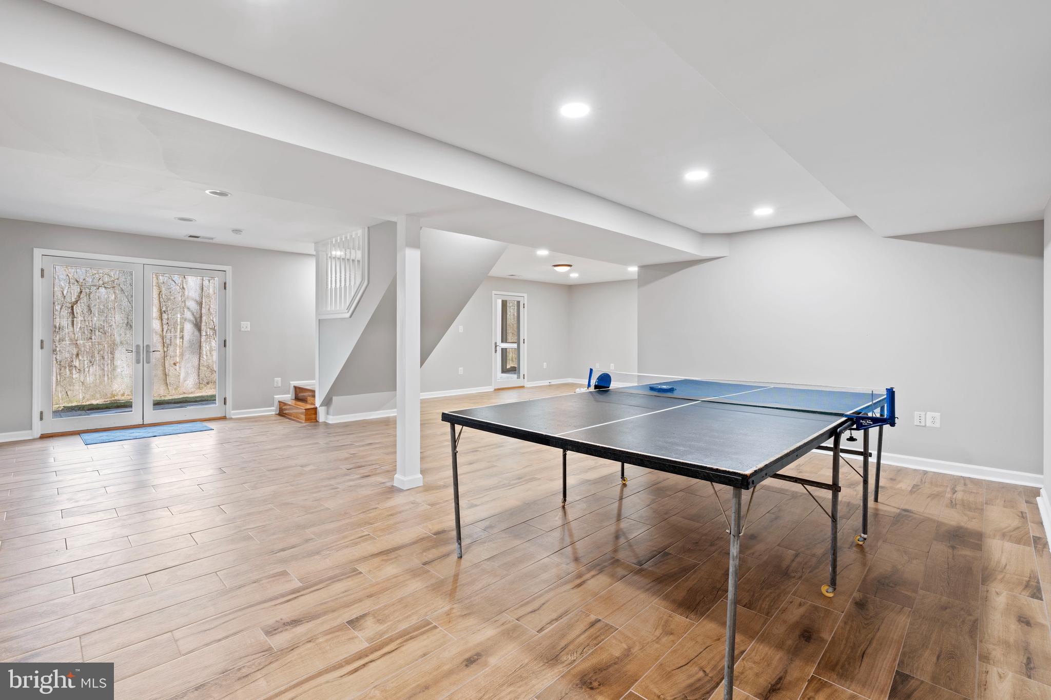18012 Highfield Road Ashton, MD 20861 - Photo 26 of 39 Large entertaining basement with access to patio