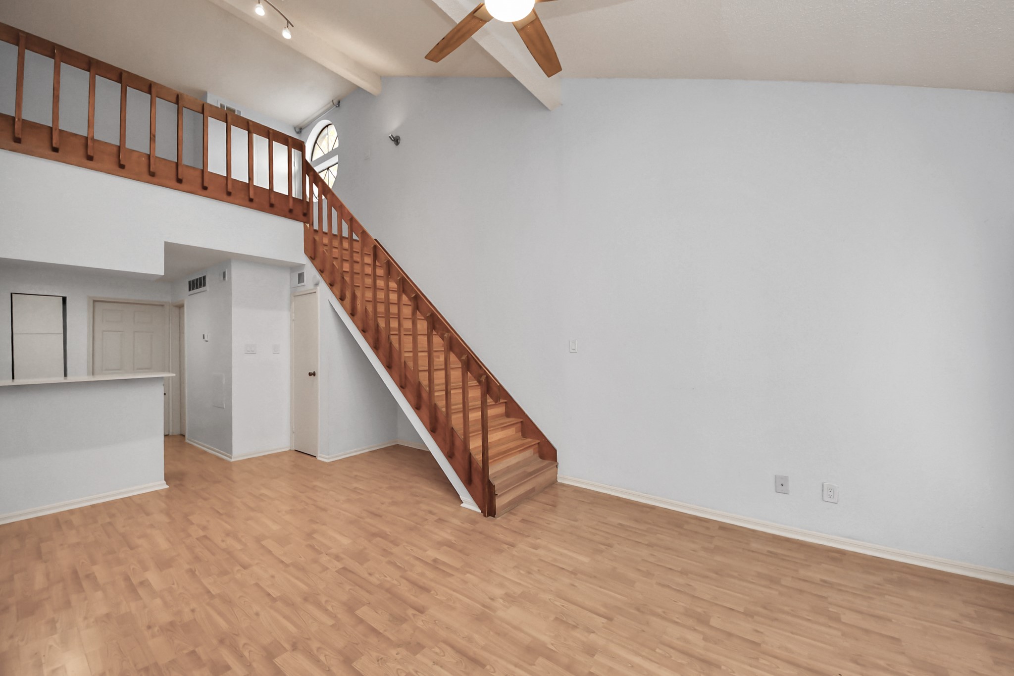 2425 Holly Hall Street, Unit C54 Houston, TX 77054 - Photo 5 of 22 a view of staircase with white walls and a window