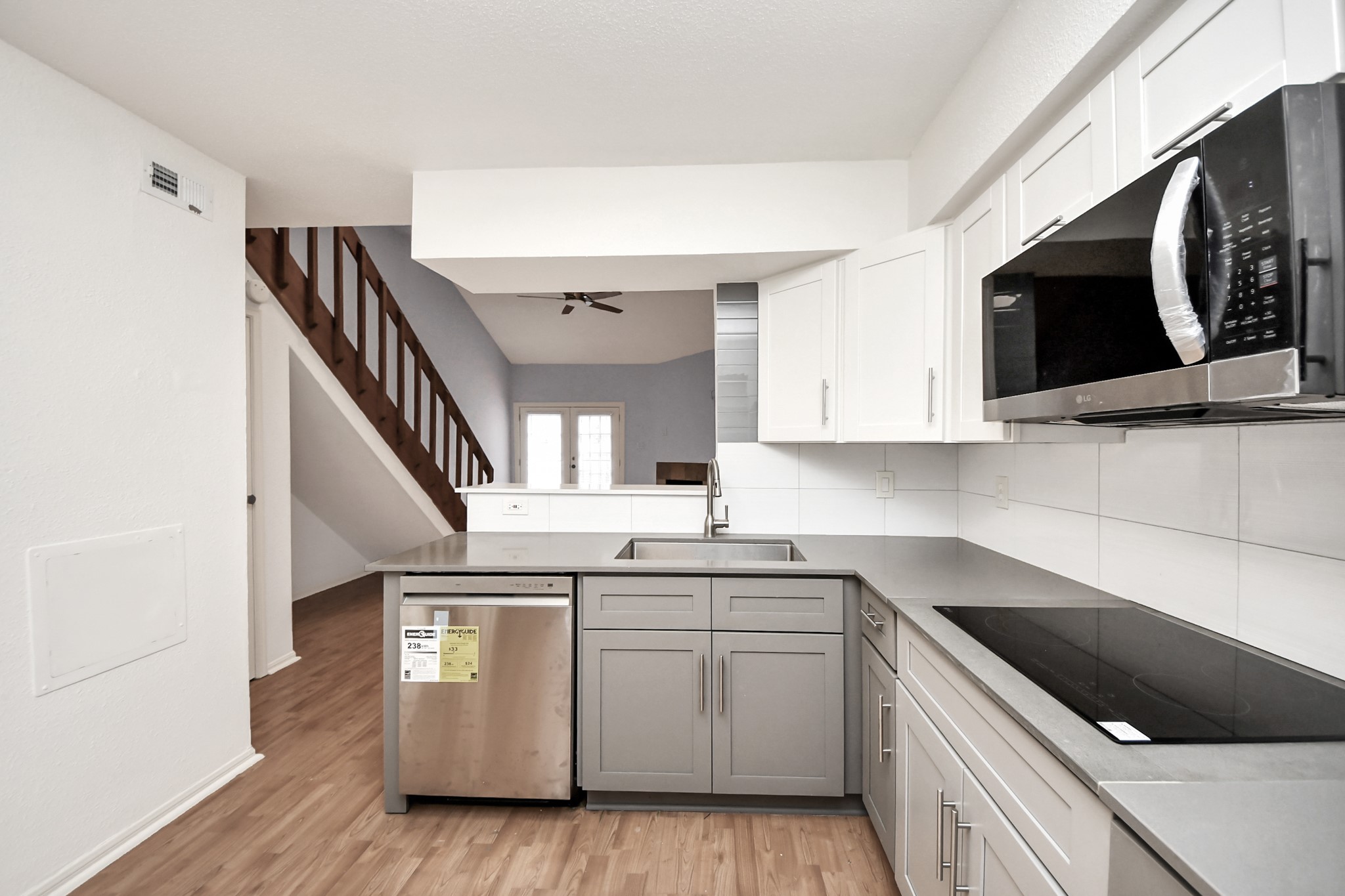 2425 Holly Hall Street, Unit C54 Houston, TX 77054 - Photo 8 of 22 a kitchen with stainless steel appliances granite countertop a sink and a microwave