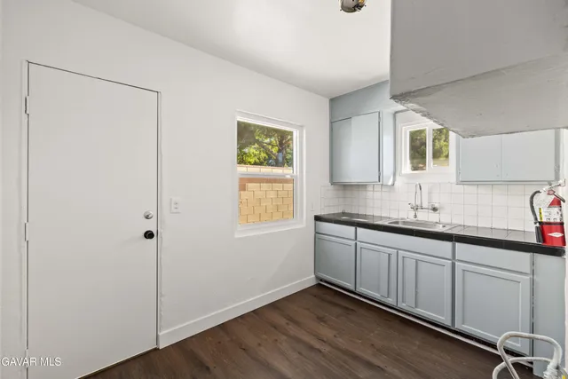 a bathroom with a double vanity sink and mirror