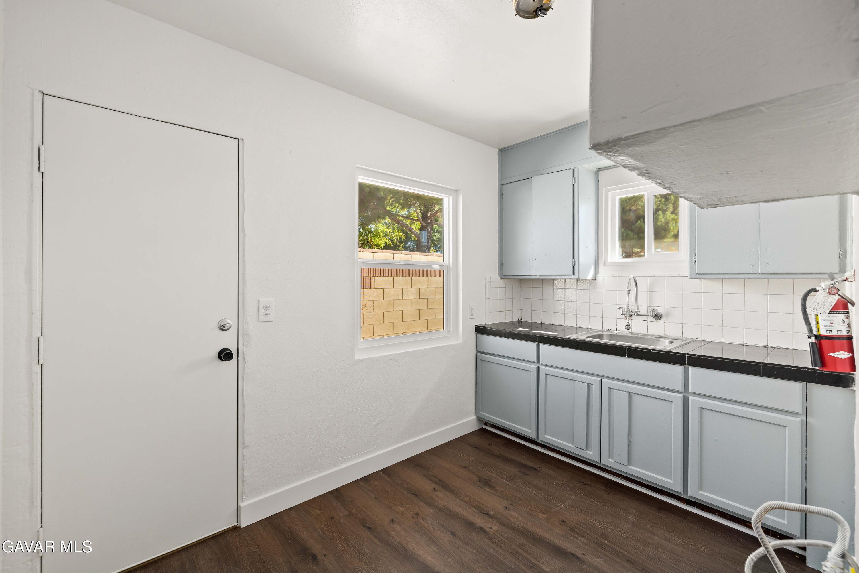 45148 Date Avenue Lancaster, CA 93534 - Photo 11 of 32 a bathroom with a double vanity sink and mirror