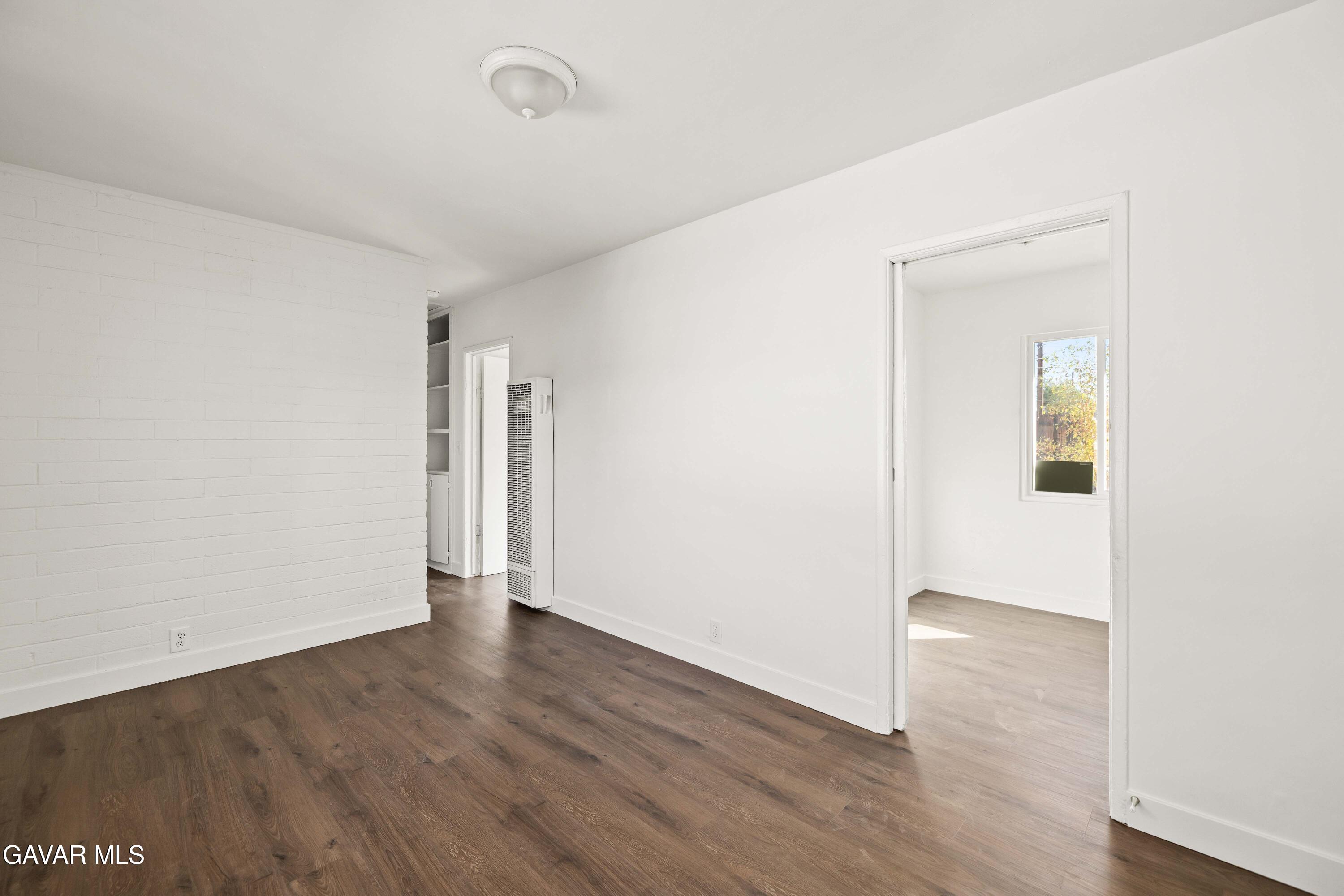 45148 Date Avenue Lancaster, CA 93534 - Photo 21 of 32 an empty room with wooden floor and closet