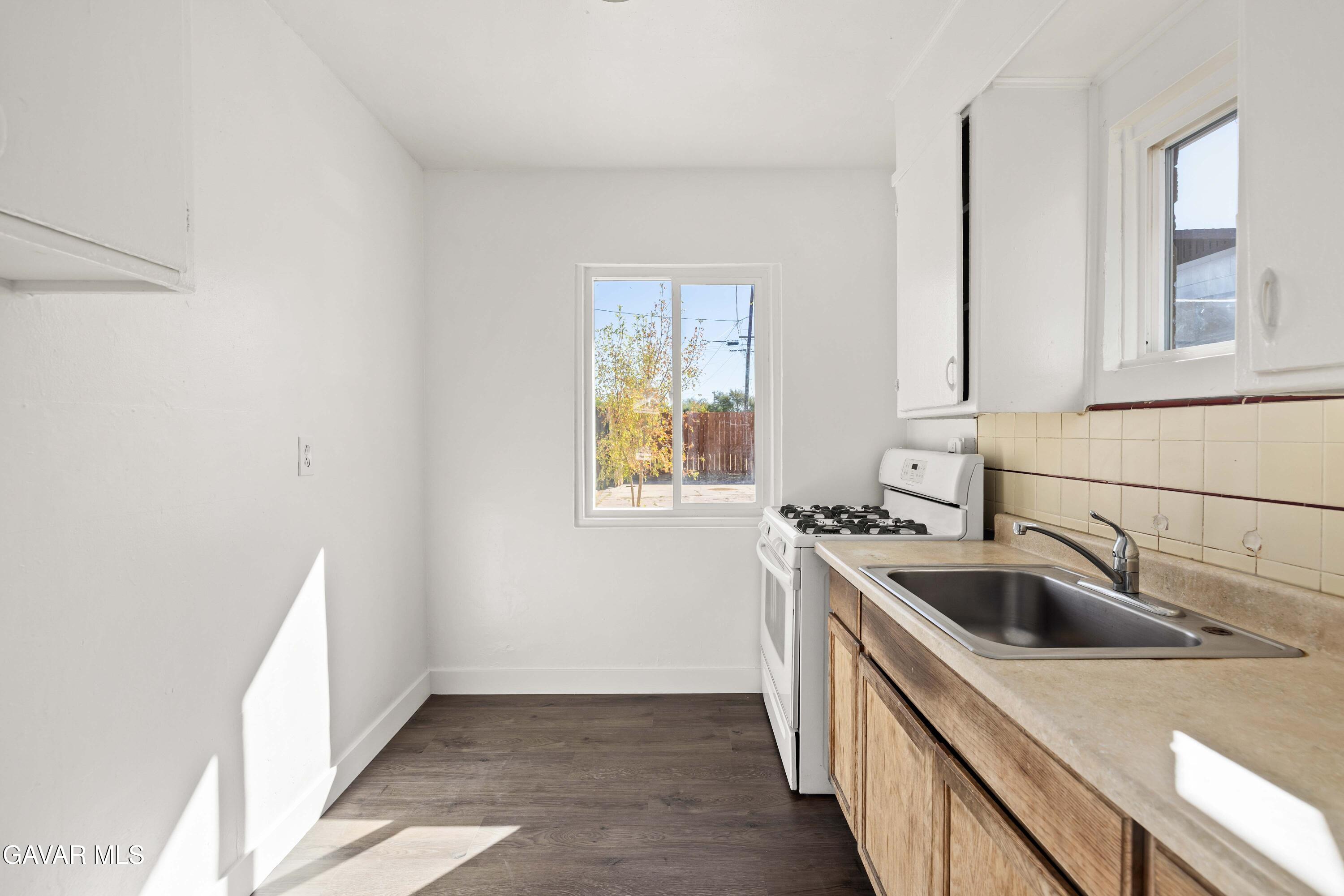 45148 Date Avenue Lancaster, CA 93534 - Photo 26 of 32 a kitchen with a sink and a window