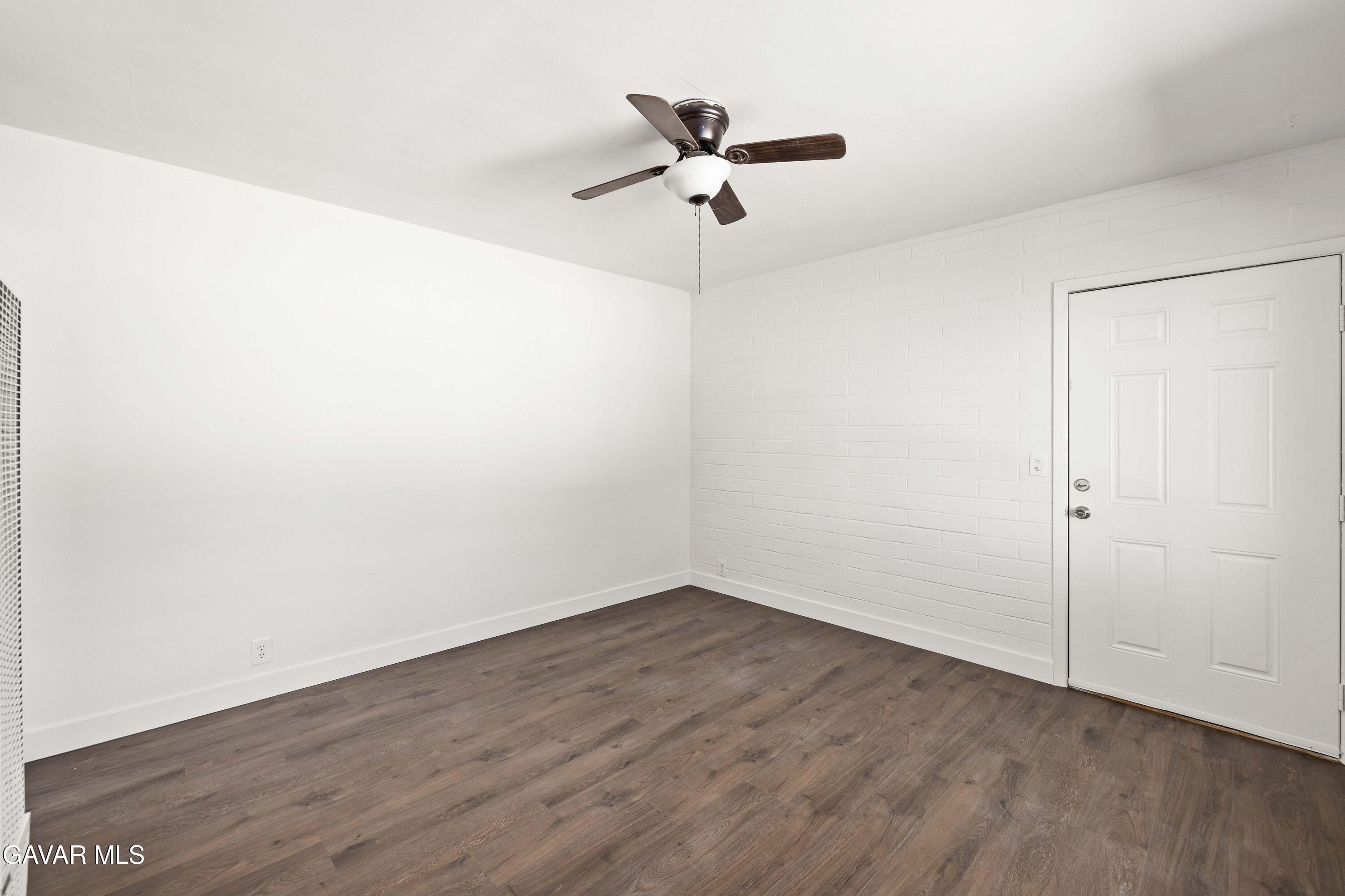 45148 Date Avenue Lancaster, CA 93534 - Photo 6 of 32 a view of a room with wooden floor