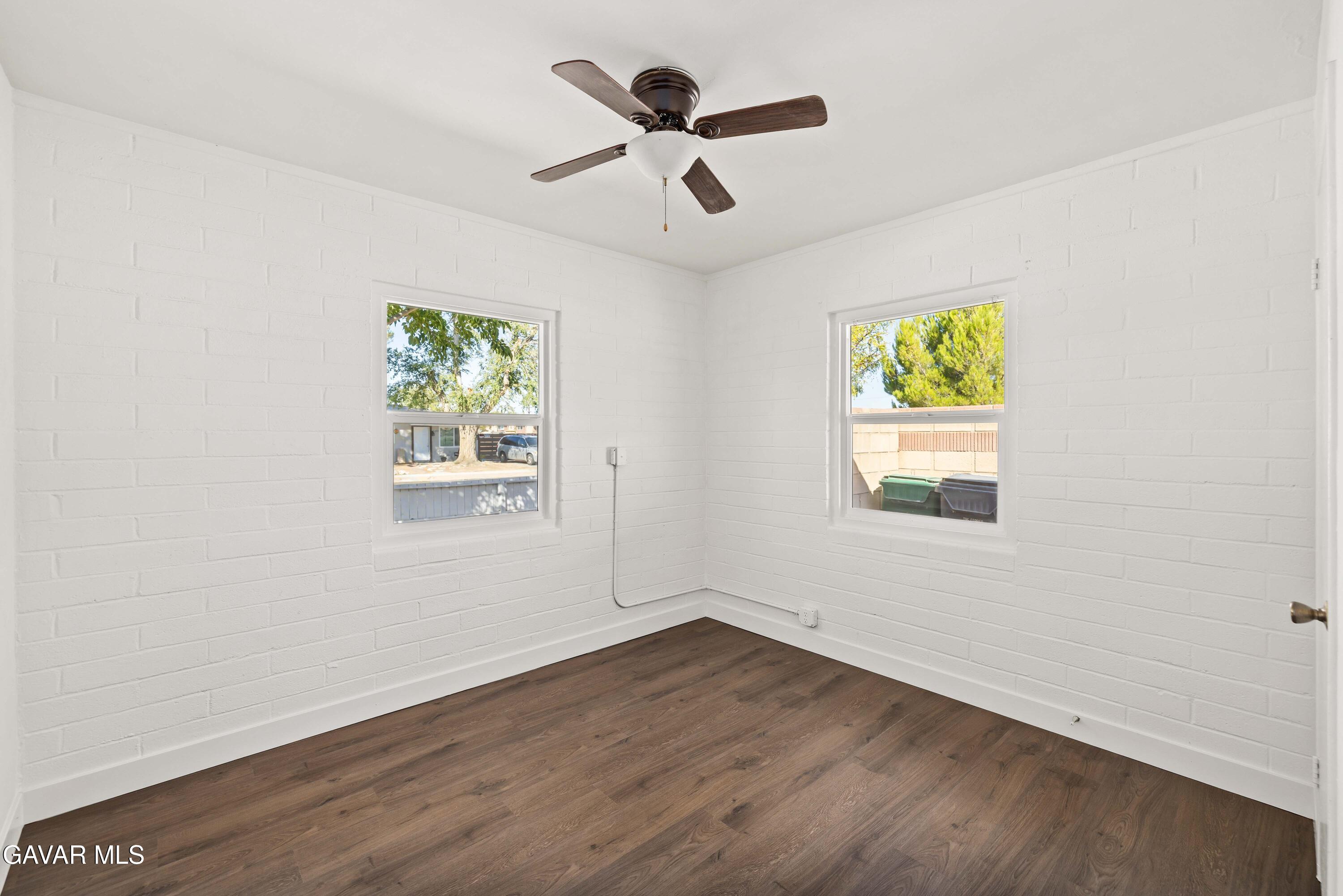 45148 Date Avenue Lancaster, CA 93534 - Photo 8 of 32 an empty room with window and ceiling fan