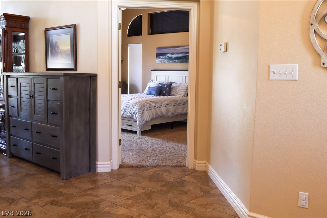 2775 Taylor Street Logandale, NV 89021 - Photo 3 of 41 This inviting bedroom, viewed through an open doorway, offers a tranquil retreat.