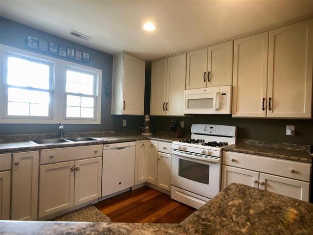 9987 East High Road Stillman Valley, IL 61084 - Photo 12 of 25 a kitchen with cabinets appliances and a window