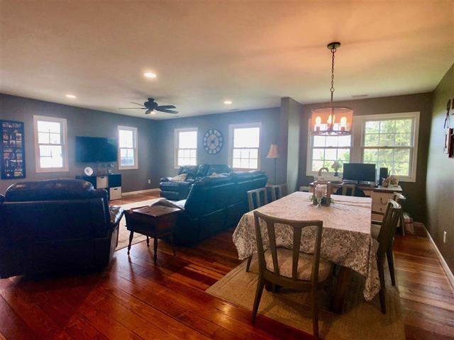 9987 East High Road Stillman Valley, IL 61084 - Photo 13 of 25 a view of a a dining room with furniture window and wooden floor