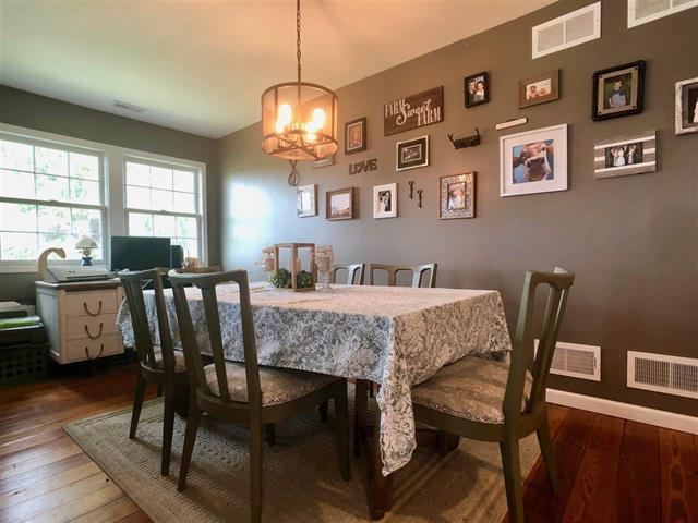 9987 East High Road Stillman Valley, IL 61084 - Photo 18 of 25 a view of a dining room with furniture