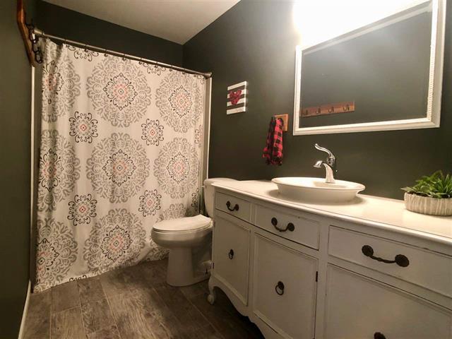 9987 East High Road Stillman Valley, IL 61084 - Photo 22 of 25 a bathroom with a sink and a mirror