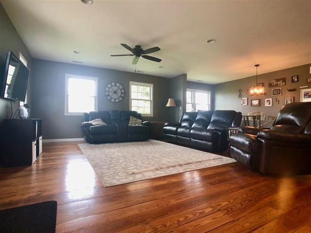 9987 East High Road Stillman Valley, IL 61084 - Photo 8 of 25 a living room with furniture window and wooden floor