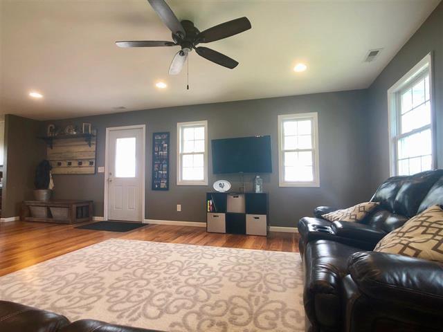 9987 East High Road Stillman Valley, IL 61084 - Photo 9 of 25 a living room with furniture and window