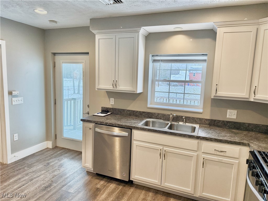 3024 Dutt Road Barberton, OH 44203 - Photo 20 of 33 ENJOY THE KITCHEN APPLIANCES, ALL INCLUDED! STAINLESS STEEL APPLIANCES INSTALLED BRAND-NEW IN 2019! CUPBOARDS AND COUNTER TOPS ALSO NEW IN 2019!