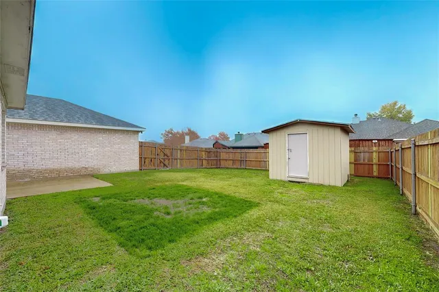 a house view with a garden space