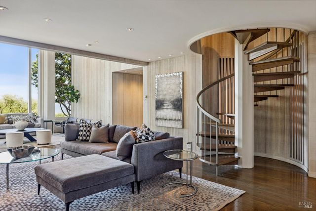 a kitchen with granite countertop a stove a sink and a refrigerator