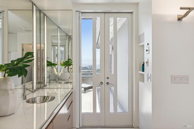a view of a patio with a table and chairs