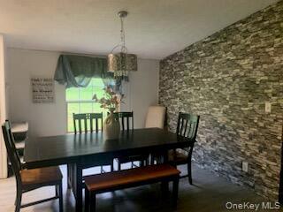 76 Parks Road Livingston Manor, NY 12758 - Photo 2 of 15 Dining room with wood finished floors and a chandelier
