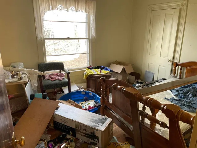 a bedroom with furniture and a gym equipment