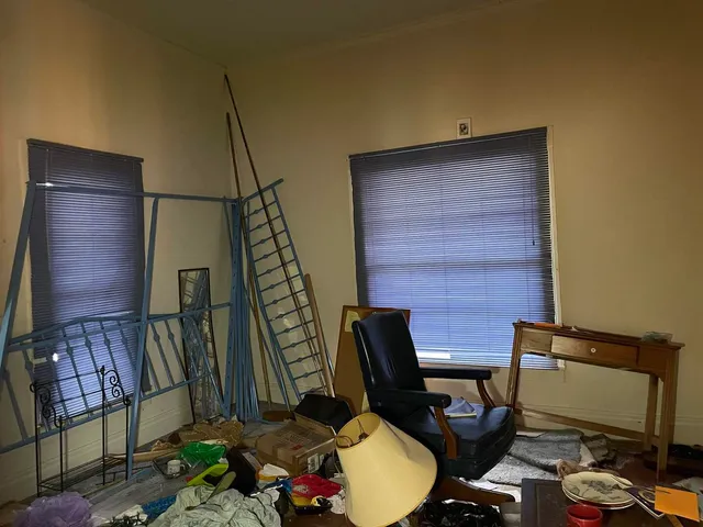 a bed room with furniture and a window