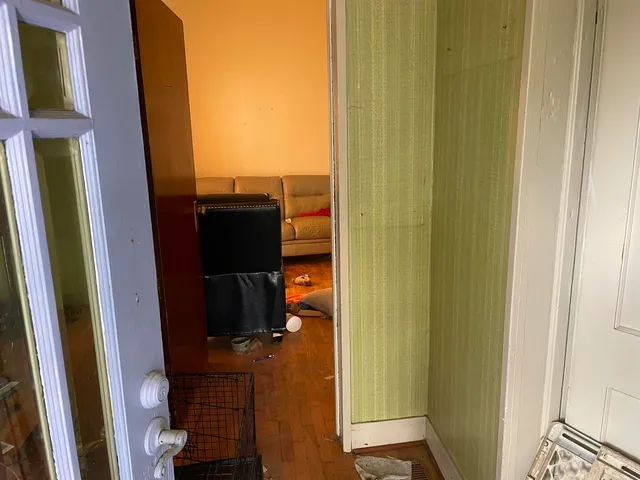 a room with gym equipment and large mirror