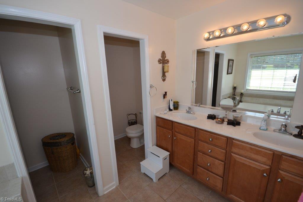 2497 Danny Bell Road Asheboro, NC 27205 - Photo 13 of 20 Master with double vanity, garden tub, separate show, tile flooring