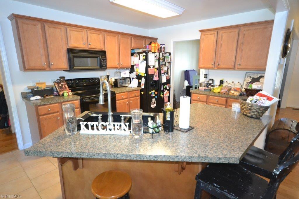 2497 Danny Bell Road Asheboro, NC 27205 - Photo 6 of 20 Kitchen island with eat-at bar