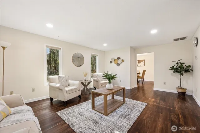 a living room with furniture and a table