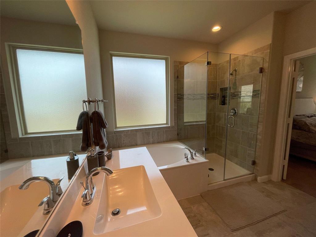 1904 Cardinal Way Argyle, TX 76226 - Photo 13 of 17 a bathroom with a tub sink and a mirror
