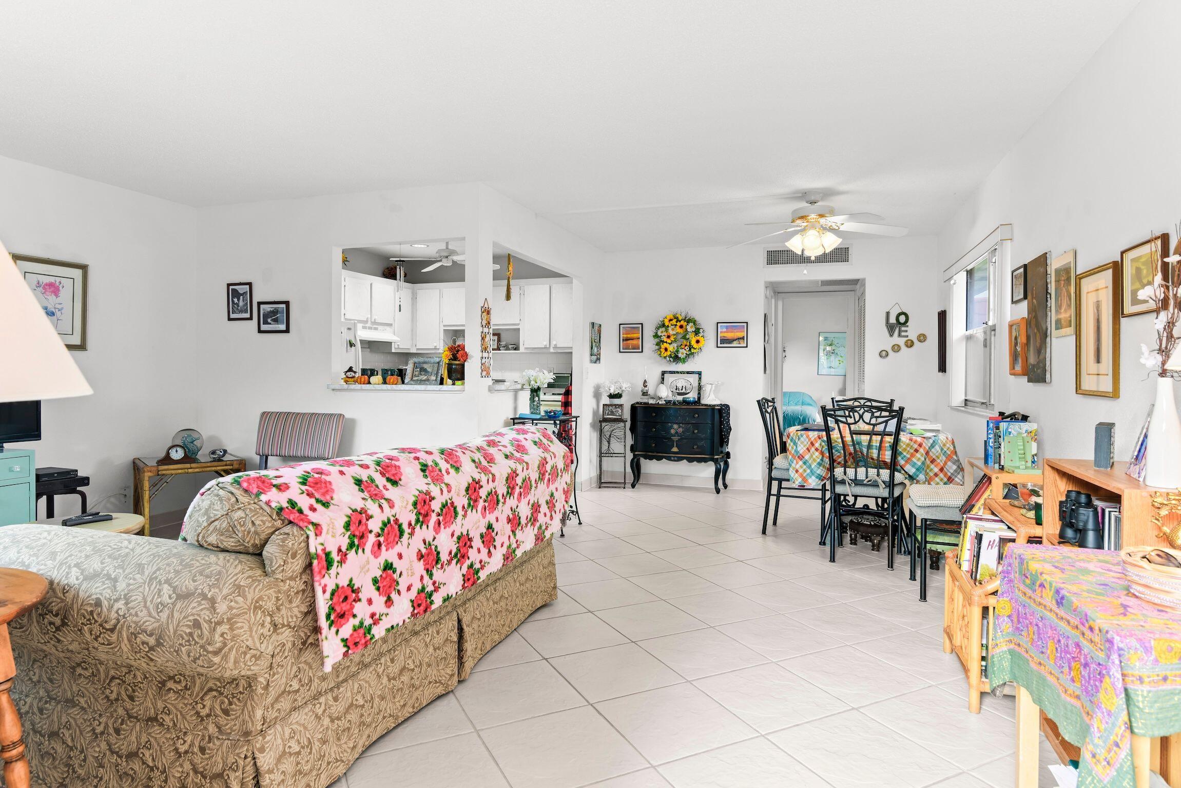 287 Seville L, Unit L Delray Beach, FL 33446 - Photo 18 of 39 a bedroom with furniture and window