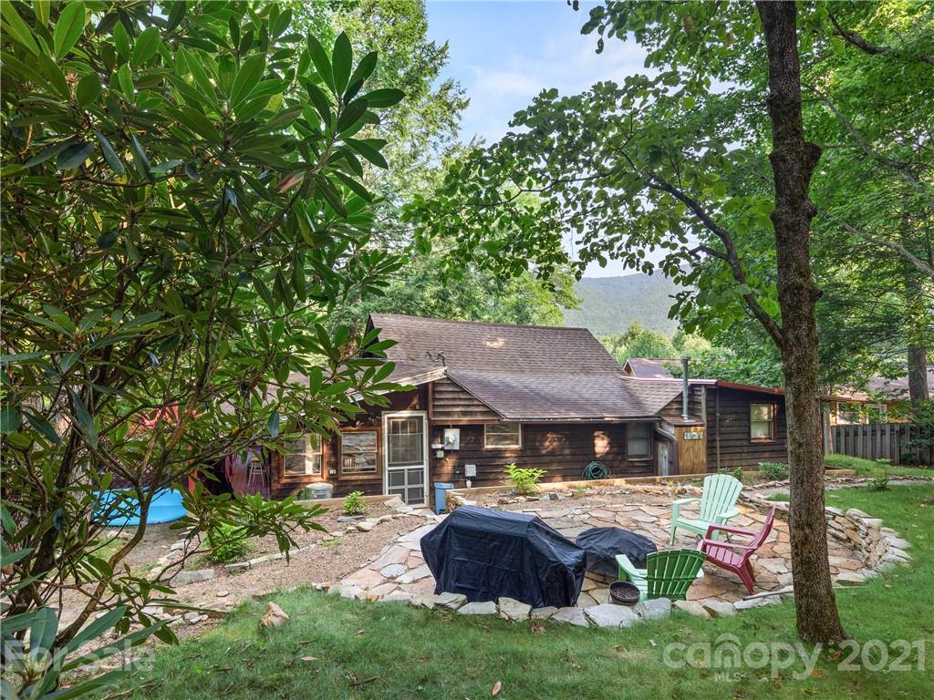 139 Holly Road Black Mountain, NC 28711 - Photo 12 of 21 a front view of house with yard and outdoor seating