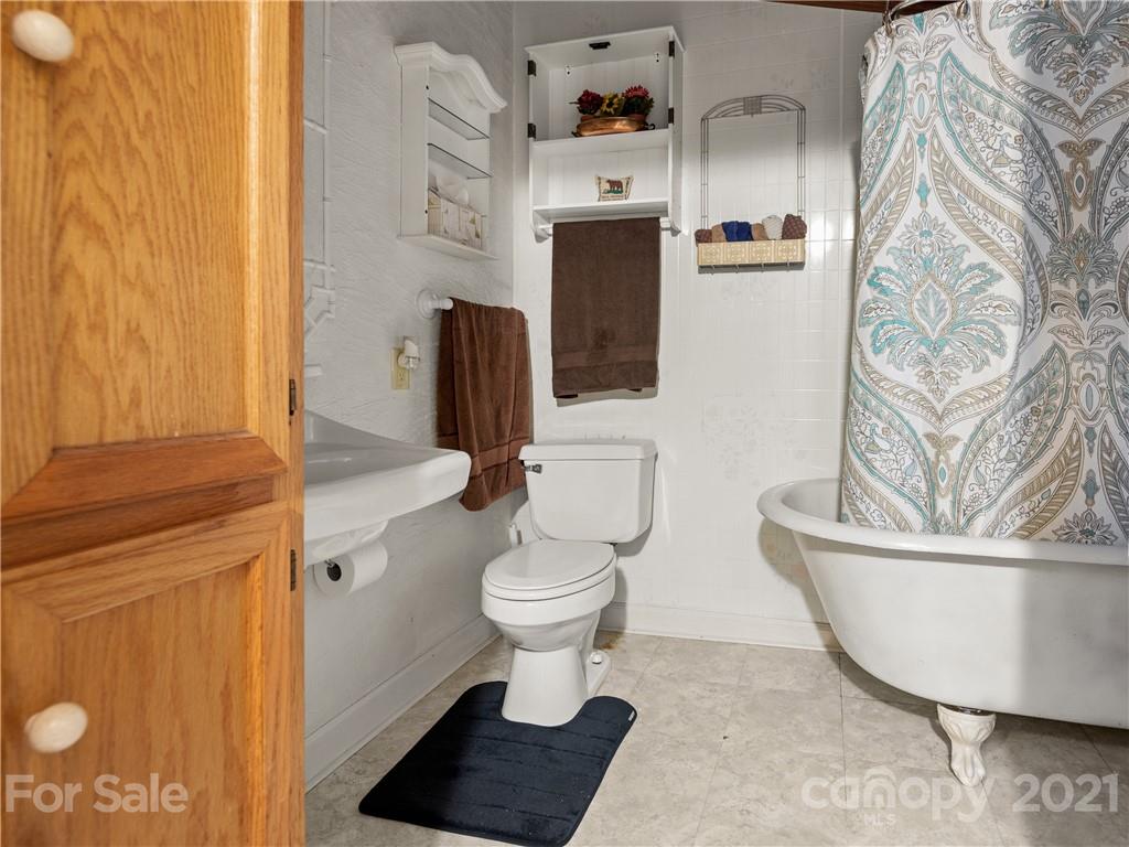139 Holly Road Black Mountain, NC 28711 - Photo 16 of 21 a bathroom with a toilet and a sink
