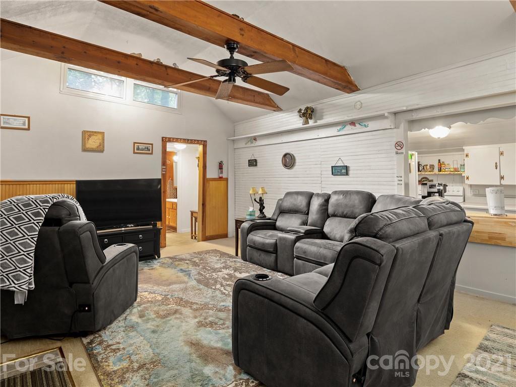 139 Holly Road Black Mountain, NC 28711 - Photo 6 of 21 a living room with furniture and a flat screen tv