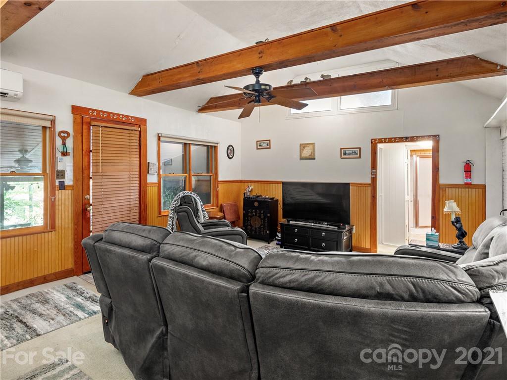 139 Holly Road Black Mountain, NC 28711 - Photo 7 of 21 a living room with furniture and a flat screen tv