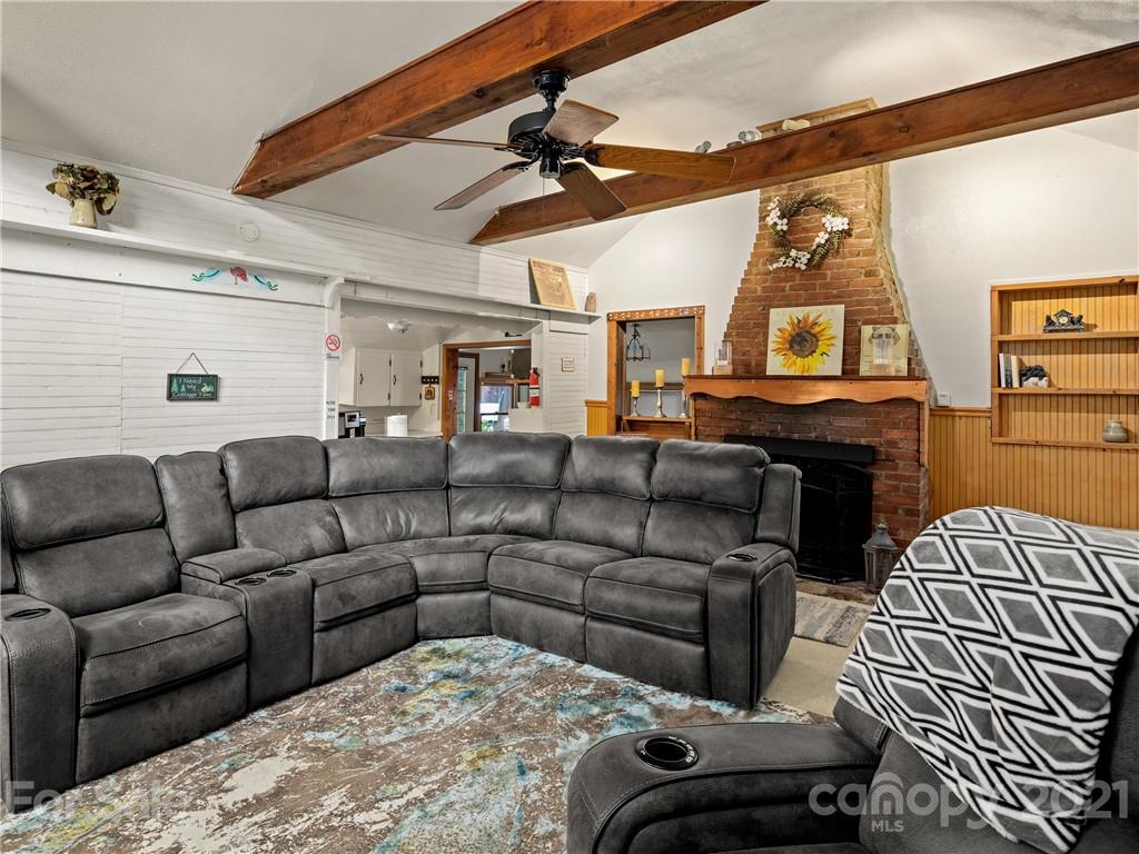 139 Holly Road Black Mountain, NC 28711 - Photo 8 of 21 a living room with furniture and a fireplace