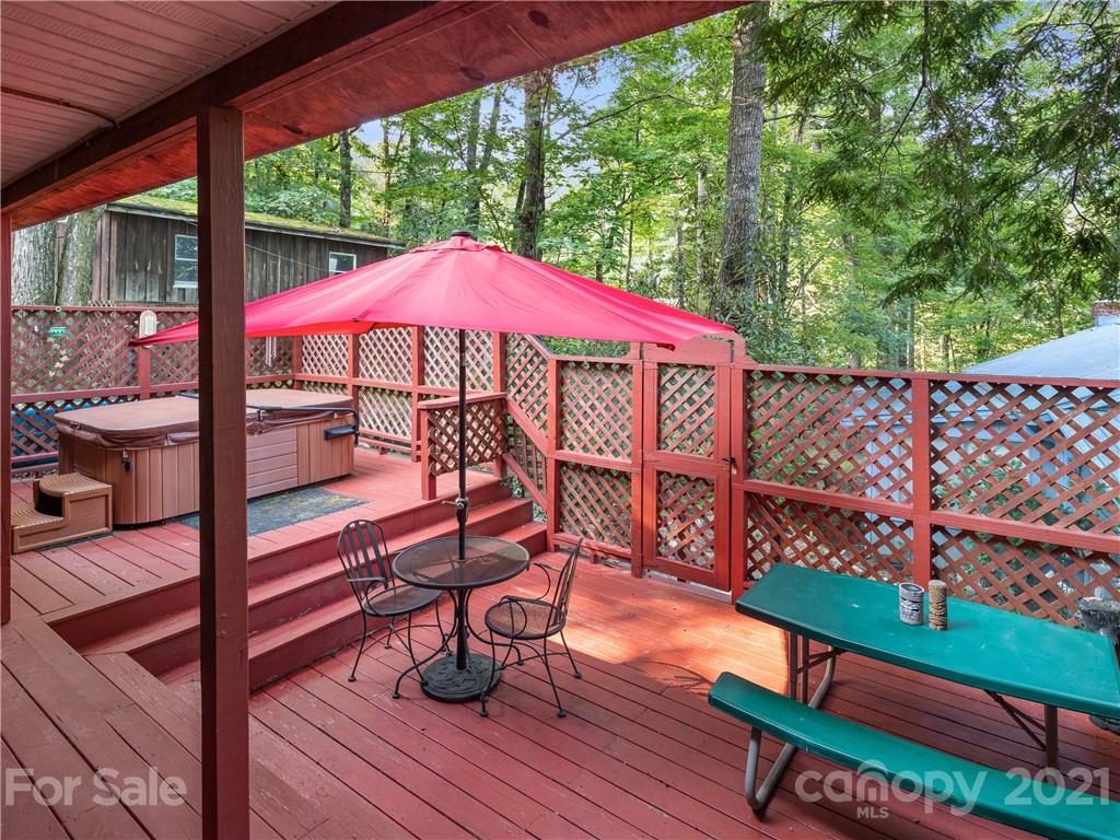 139 Holly Road Black Mountain, NC 28711 - Photo 10 of 21 a view of a chairs and table in the patio