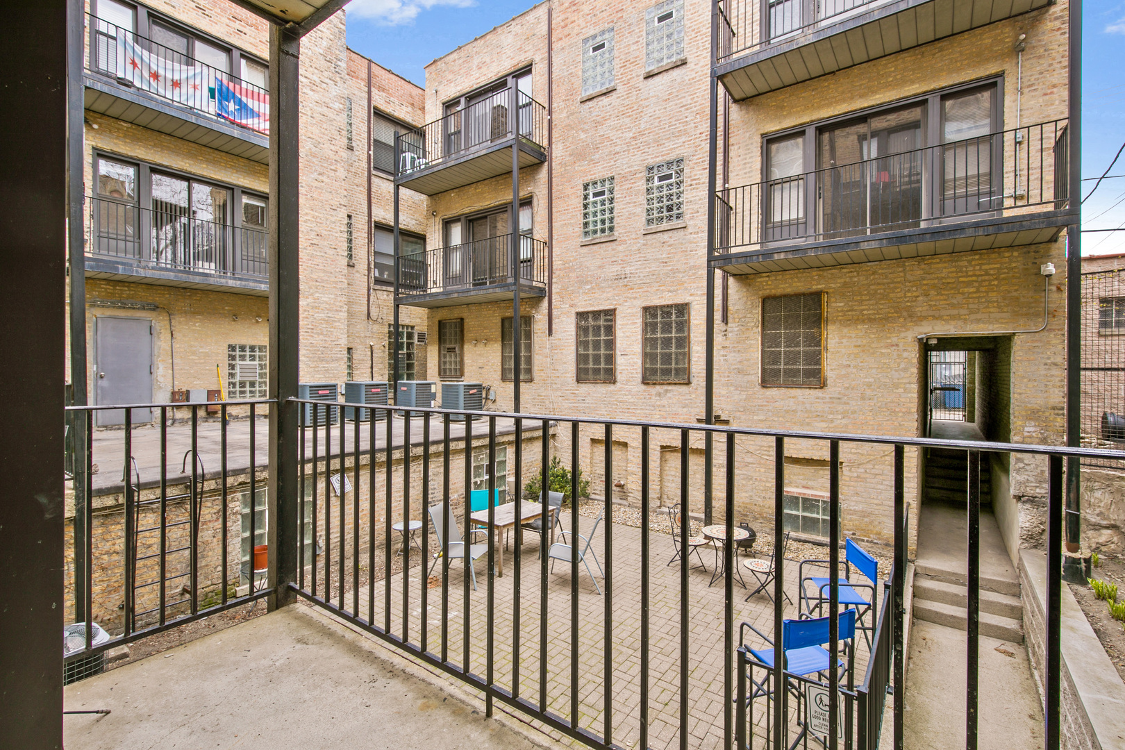 4555 North Malden Street, Unit 102 Chicago, IL 60640 - Photo 4 of 10 a view of a building from a balcony