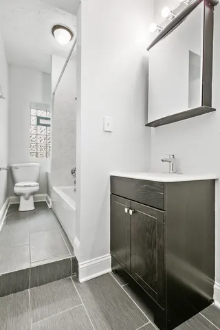 a bathroom with a sink and mirror