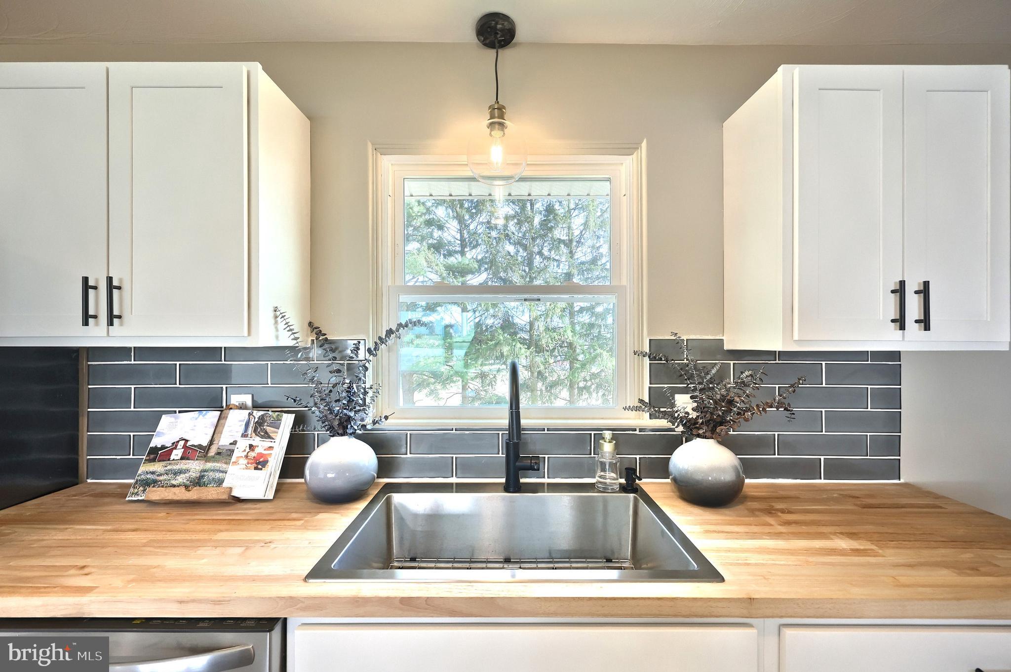 880 Springvale Road Red Lion, PA 17356 - Photo 16 of 39 a kitchen with a granite countertop sink and a counter space