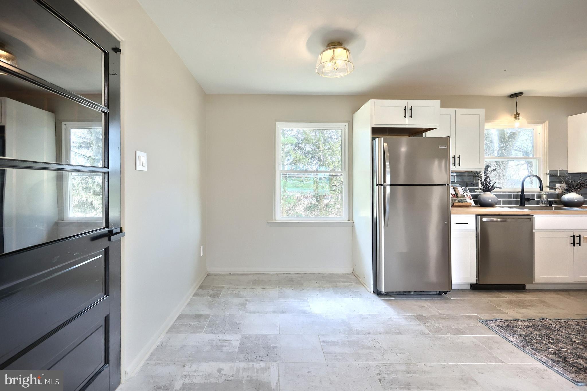 880 Springvale Road Red Lion, PA 17356 - Photo 19 of 39 a view of kitchen with furniture a refrigerator and a washer dryer