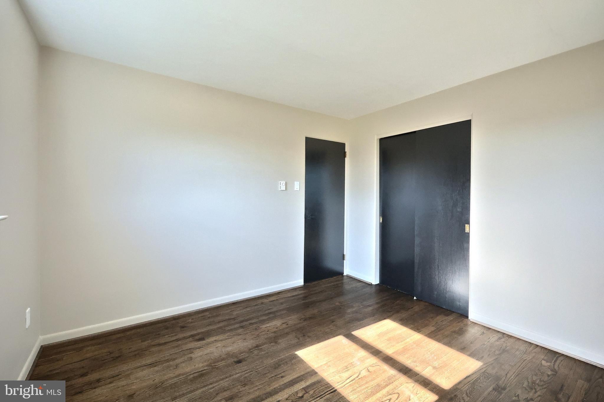 880 Springvale Road Red Lion, PA 17356 - Photo 25 of 39 an empty room with wooden floor and windows