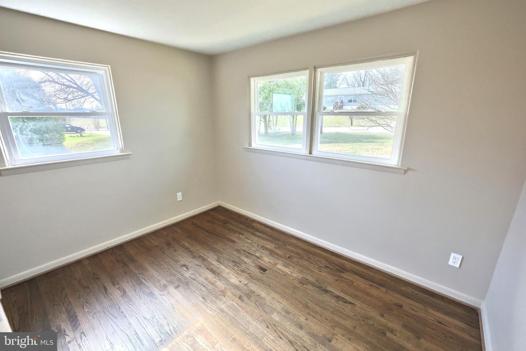 880 Springvale Road Red Lion, PA 17356 - Photo 26 of 39 a view of an empty room with wooden floor and a window