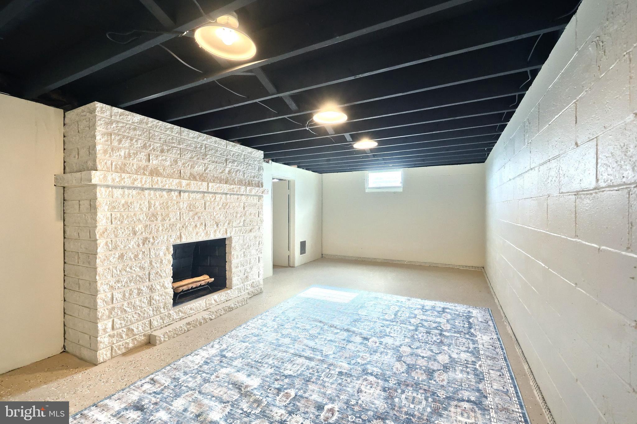 880 Springvale Road Red Lion, PA 17356 - Photo 27 of 39 a view of empty room with wooden floor and fireplace