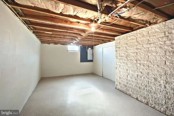 a view of a room with wooden walls
