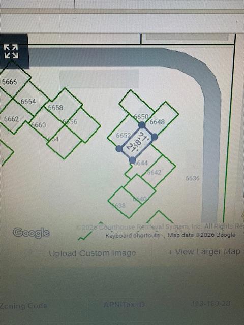 6646 North 3rd Street Fresno, CA 93710 - Photo 19 of 19 a utility room with a wooden floor and cabinets