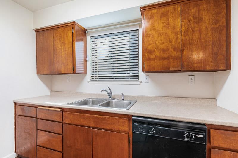 6646 North 3rd Street Fresno, CA 93710 - Photo 6 of 19 a kitchen with stainless steel appliances a sink stove and cabinets