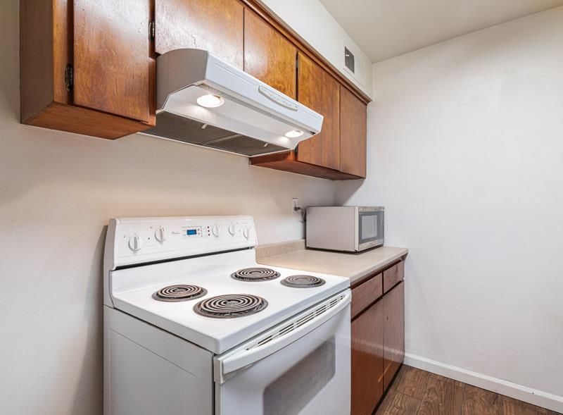 6646 North 3rd Street Fresno, CA 93710 - Photo 7 of 19 a white stove top oven sitting inside of a kitchen