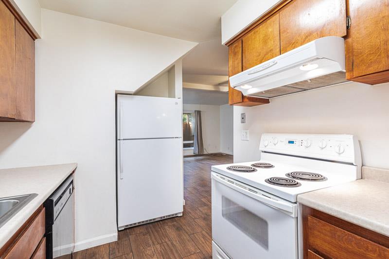 6646 North 3rd Street Fresno, CA 93710 - Photo 8 of 19 a kitchen with a stove top oven and refrigerator
