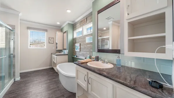 a bathroom with a bathtub shower sink and toilet